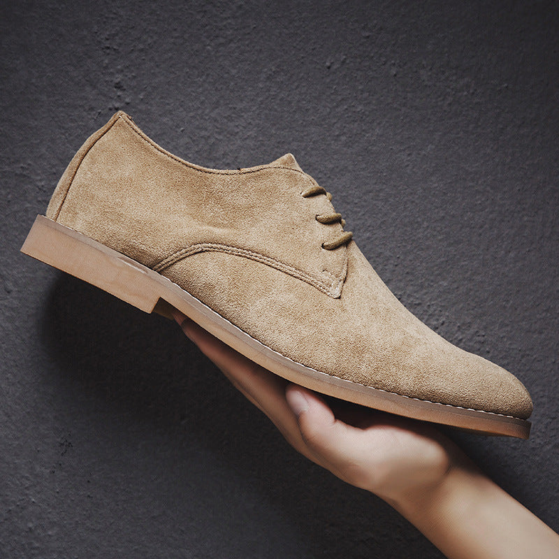 Close-up of the stitching and sole on men's premium dark brown suede Oxford casual shoes.