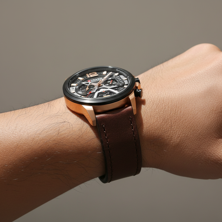 Classic men's chronograph watch with black dial and silver accents, paired with a sophisticated dark brown leather strap.