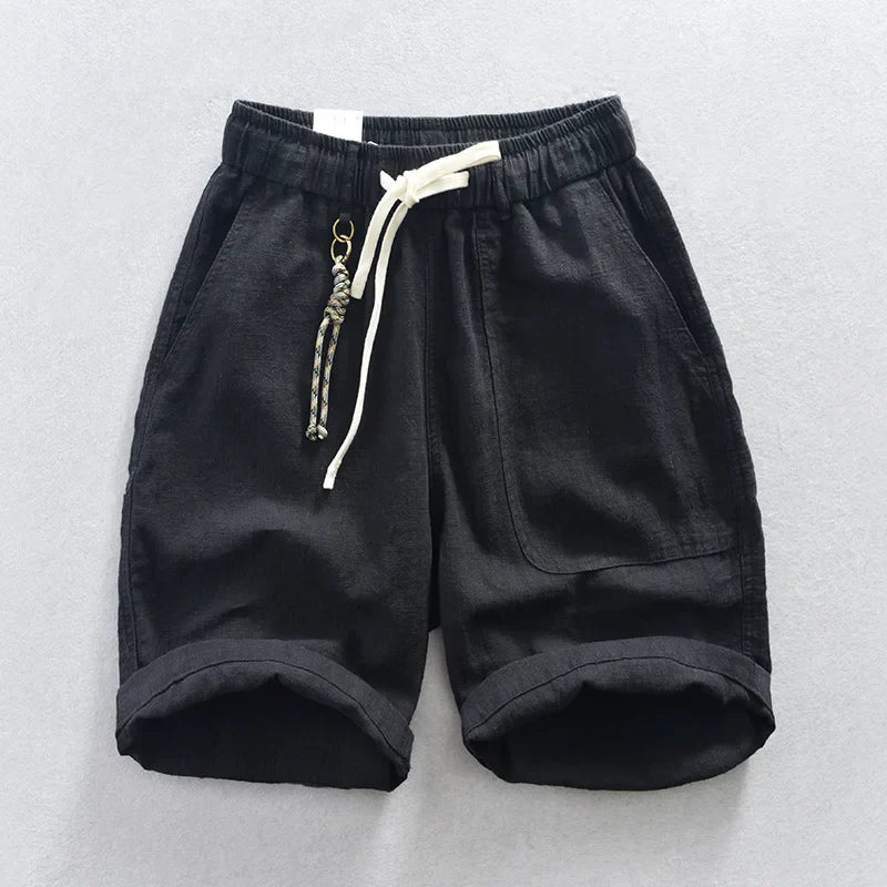 Stylish mens linen blend shorts in a neutral tone, featuring a drawstring waist and relaxed fit for summer.