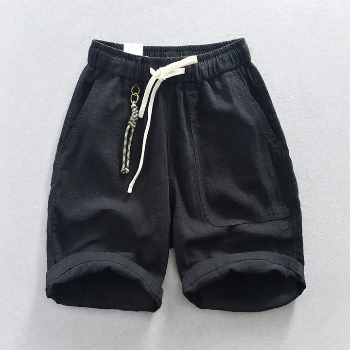 Stylish mens linen blend shorts in a neutral tone, featuring a drawstring waist and relaxed fit for summer.
