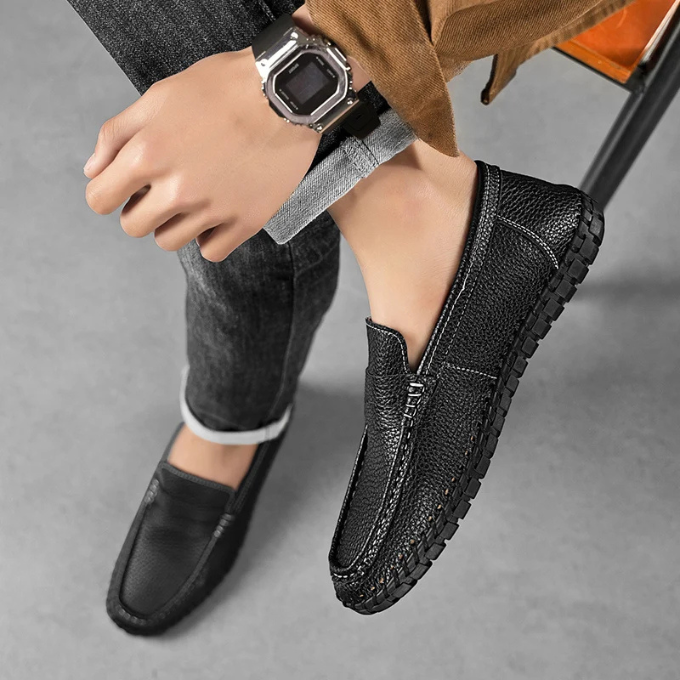 Men's classic tan full-grain leather loafers with subtle moccasin detailing