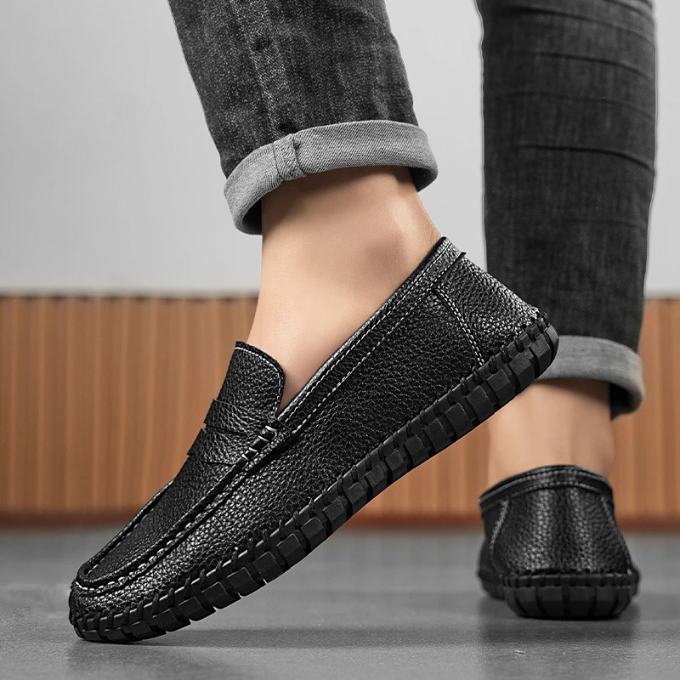 A pair of sophisticated men's full-grain leather loafers, ready to wear slip-on shoes