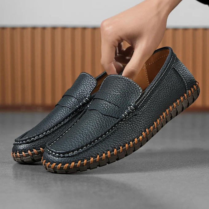 Studio shot of classic men's full-grain leather loafers, elegant mens footwear