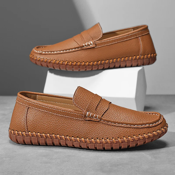 Close-up of full-grain leather texture on men's comfortable slip-on loafers