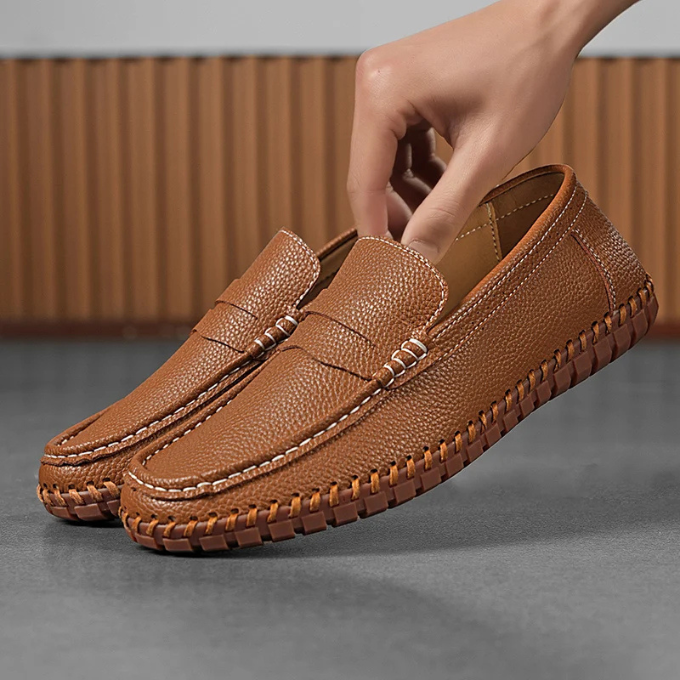 Stylish men's black leather loafers with moccasin stitching and rubber sole