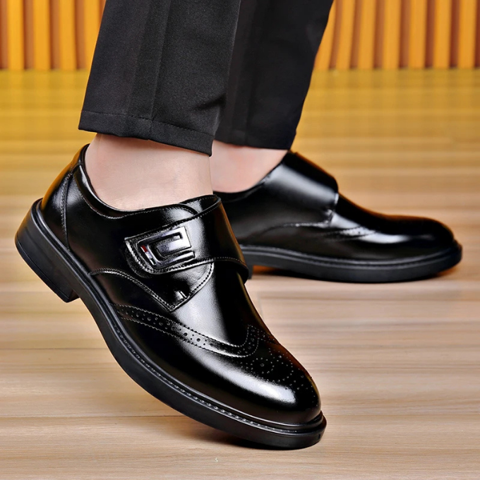 Men's classic leather shoes in an office setting, representing professional and business footwear