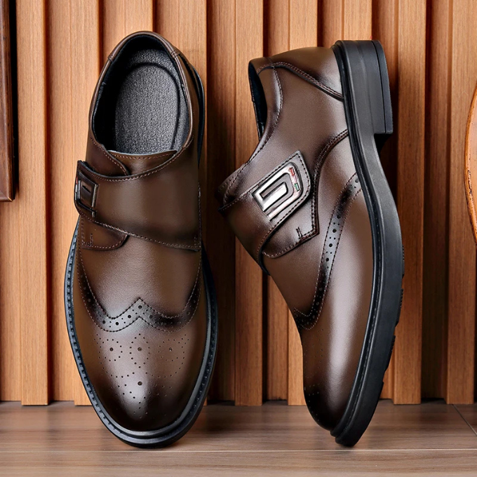 Pair of polished men's full-grain leather dress shoes, essential for a business gentleman