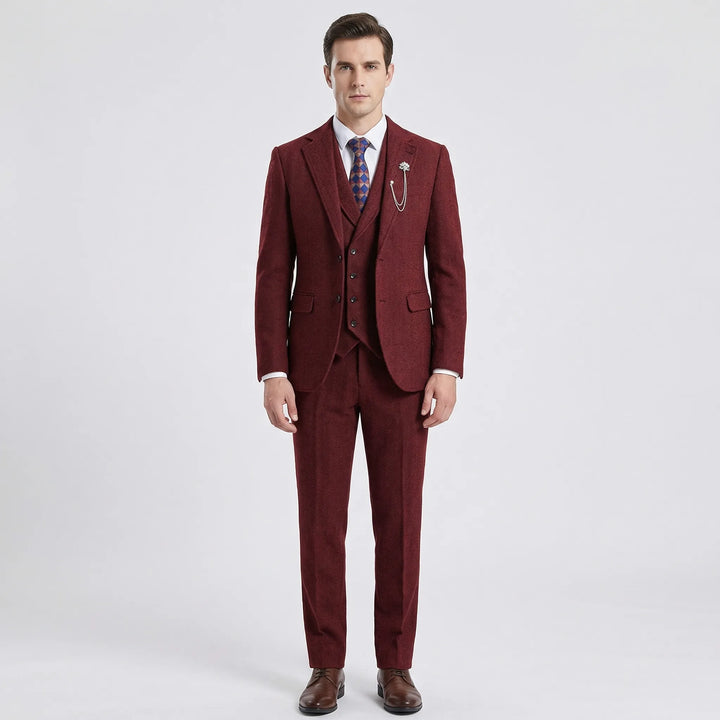 Man wearing a complete men's classic herringbone 3-piece suit, styled with shirt & tie for elegant formal events.