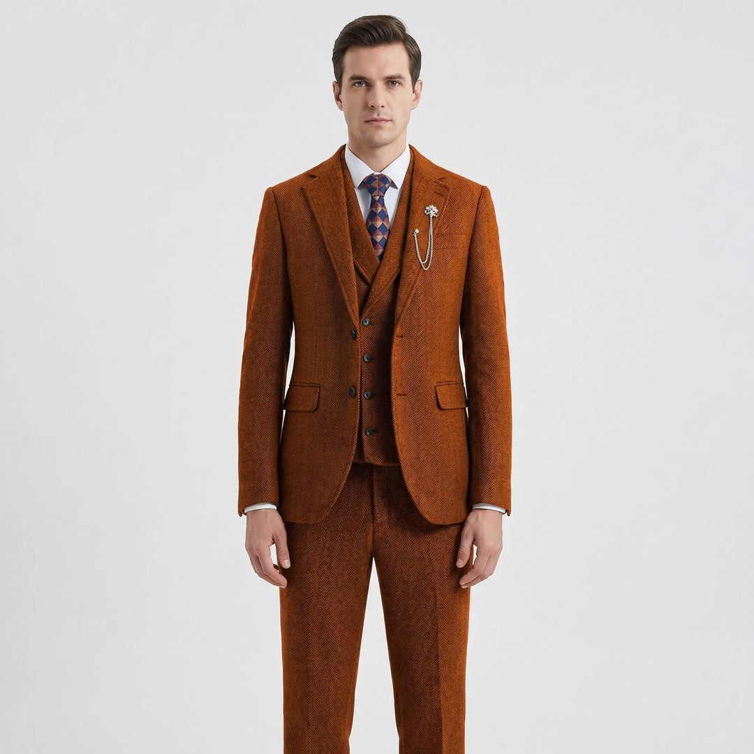Sharp, tailored men's herringbone 3-piece suit on a mannequin, highlighting the classic style & quality fit.