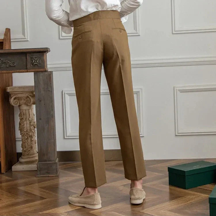 Close-up of the button and zipper closure on men's tailored straight leg dress pants, secure & sleek