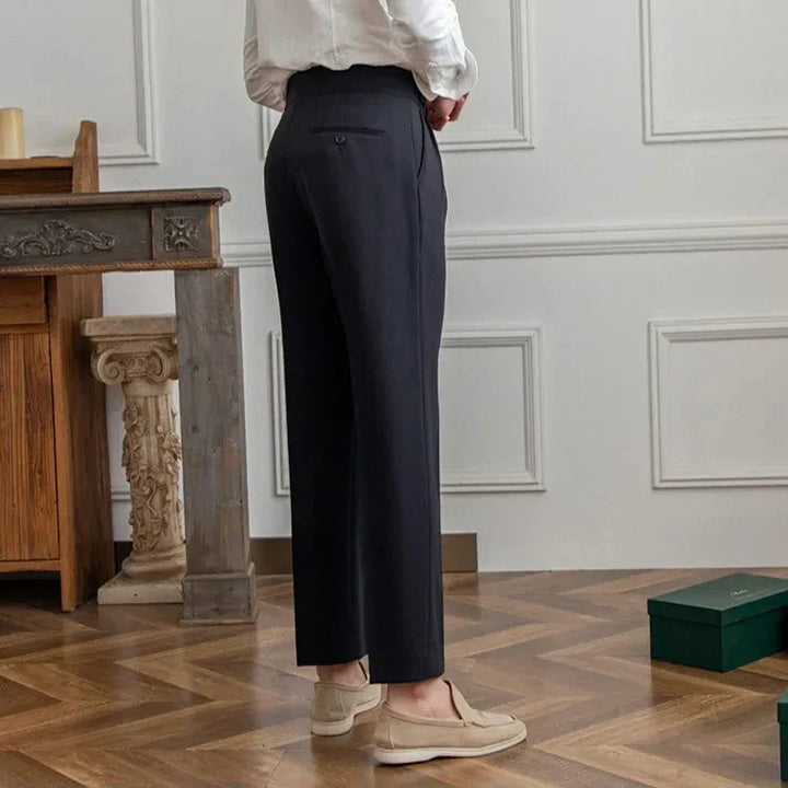 Model walking in men's comfortable straight leg dress pants, demonstrating ease of movement