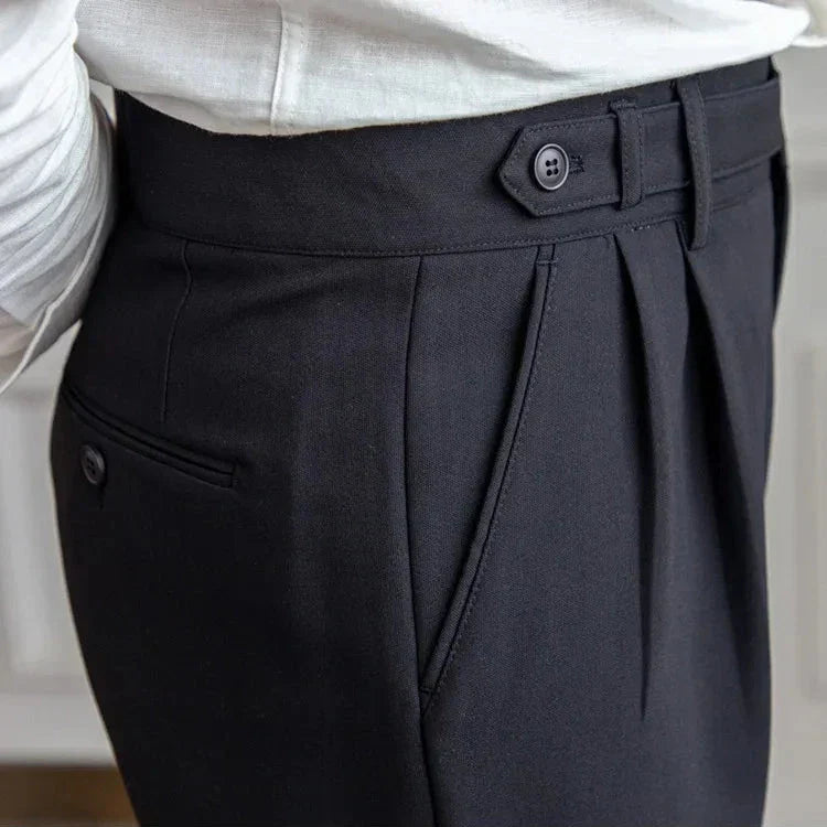 Close-up of belt loops on men's high-rise straight leg dress pants, designed for a perfect fit