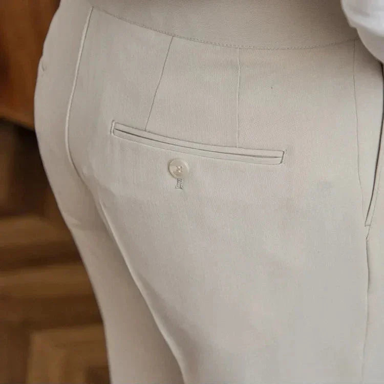Men's straight leg dress pants, rolled up to show interior, highlighting comfortable pants features