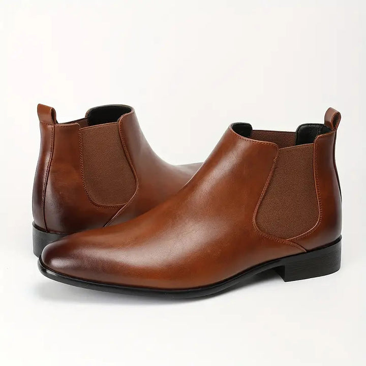 Close-up of the smooth leather texture on men's classic Chelsea boots
