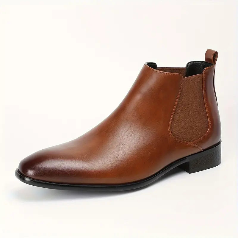 Men's pointed toe leather Chelsea boots, comfortable slip-on style, standing on a wooden floor