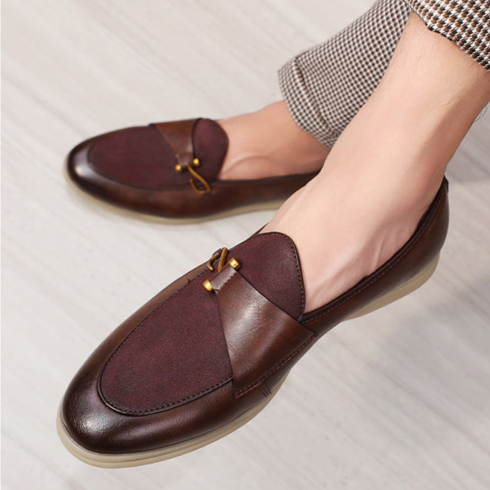 Classic men's fashion: dark brown leather loafers with a decorative gold bit, perfect for elegant outfits