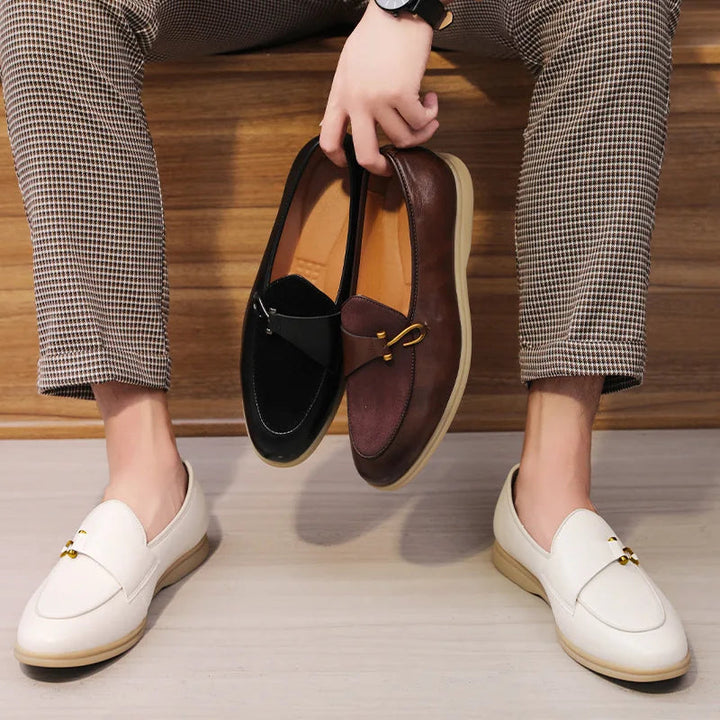 Elegant men's footwear: polished leather loafers with a shining gold bit, a timeless classic style statement