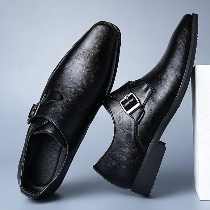 Studio shot of classic men's leather monk strap dress shoes, highlighting their elegant design and craftsmanship. Business footwear.