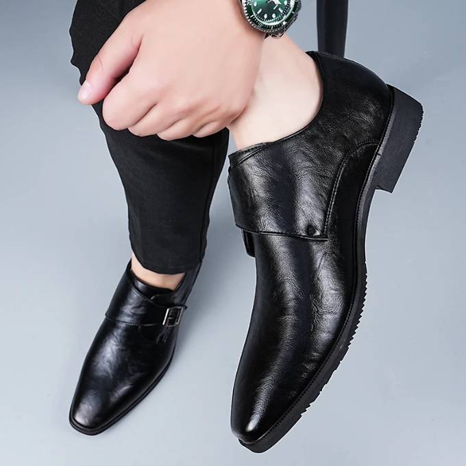 Distinguished men's leather monk strap shoes with a double buckle, embodying classic style and formal elegance.