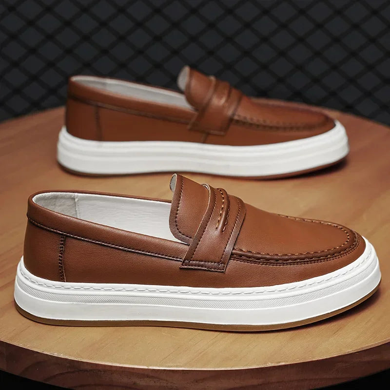 Sole detail of men's chunky leather penny loafers, showing sturdy grip
