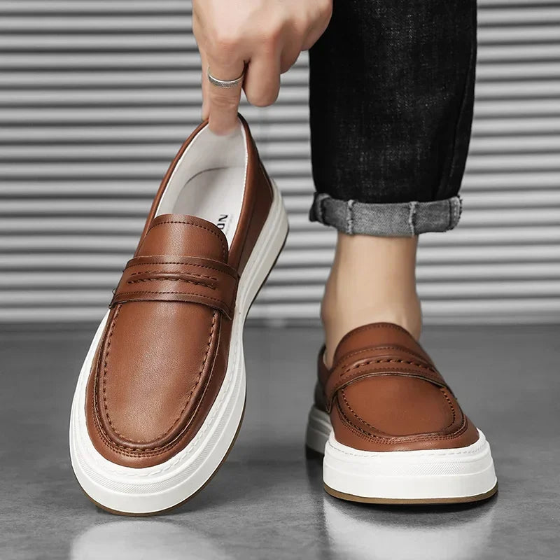 Elegant men's slip-on loafers in leather, featuring a prominent chunky sole