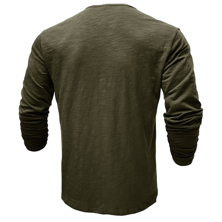 A stack of men's long-sleeve henley shirts in various colors, highlighting their versatile fashion