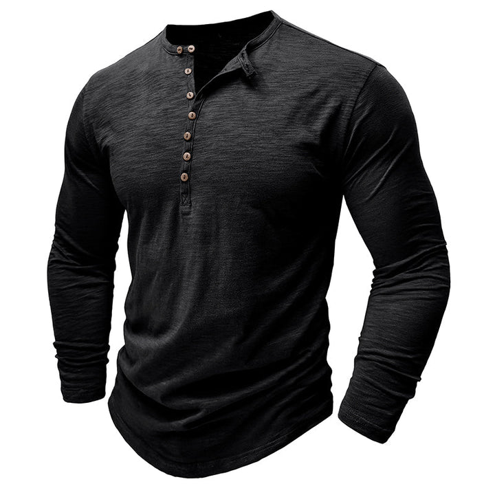 Man in an open-collar long-sleeve henley shirt, showing off its relaxed button-up style & comfort