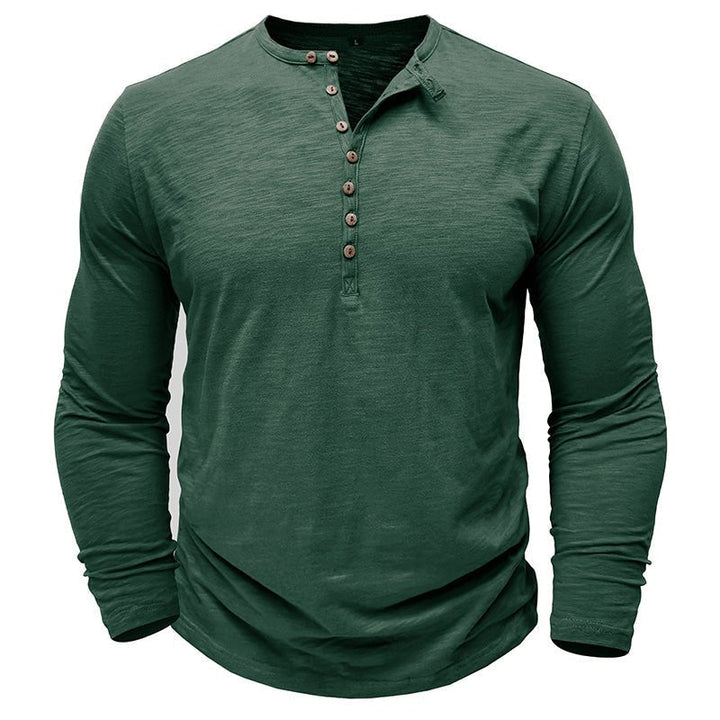 Close-up of the textured fabric on a men's classic long-sleeve henley shirt, soft & versatile