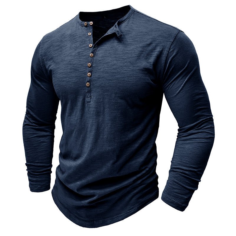 Side profile of a man in a fitting long-sleeve henley shirt, highlighting button-up detail & versatility