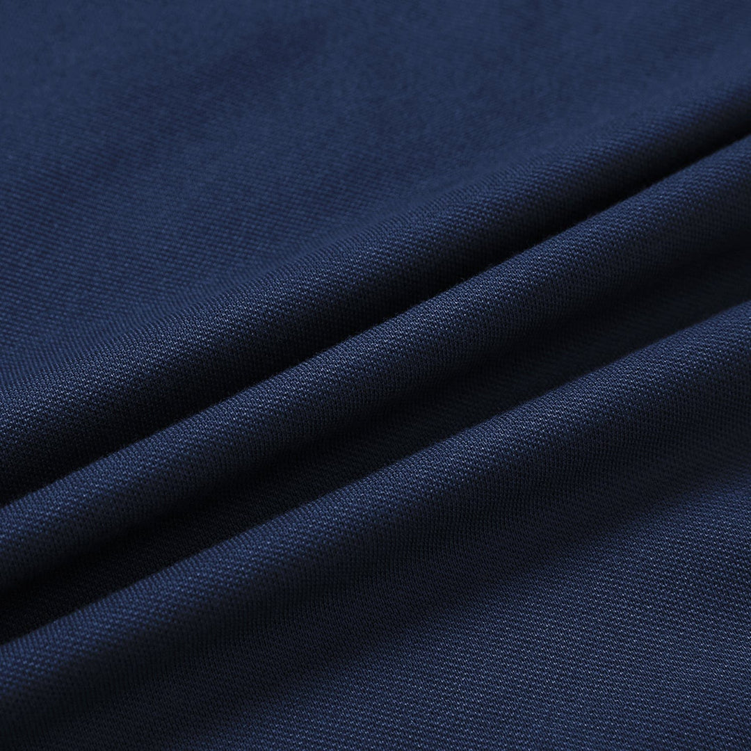 Stack of varied color men's classic long sleeve polo shirts, cotton blend, moisture wicking.