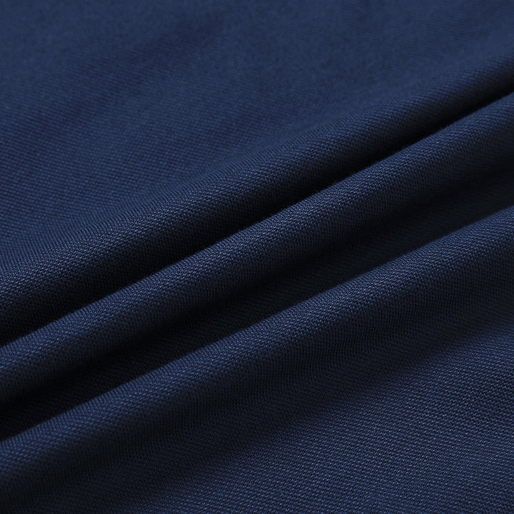 Stack of varied color men's classic long sleeve polo shirts, cotton blend, moisture wicking.