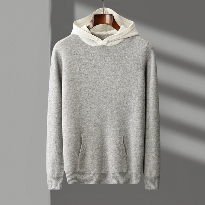 Flat lay of the merino wool pullover hoodie, showcasing its full design and the softness of the fabric.
