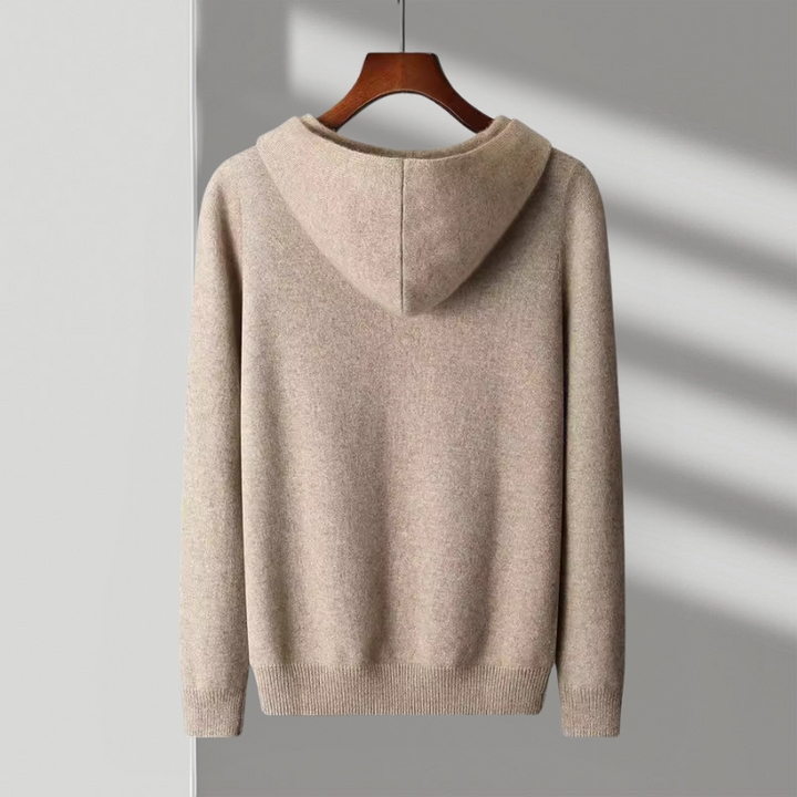 Close-up of the merino wool fabric texture on a men's classic hoodie, highlighting its softness & quality.