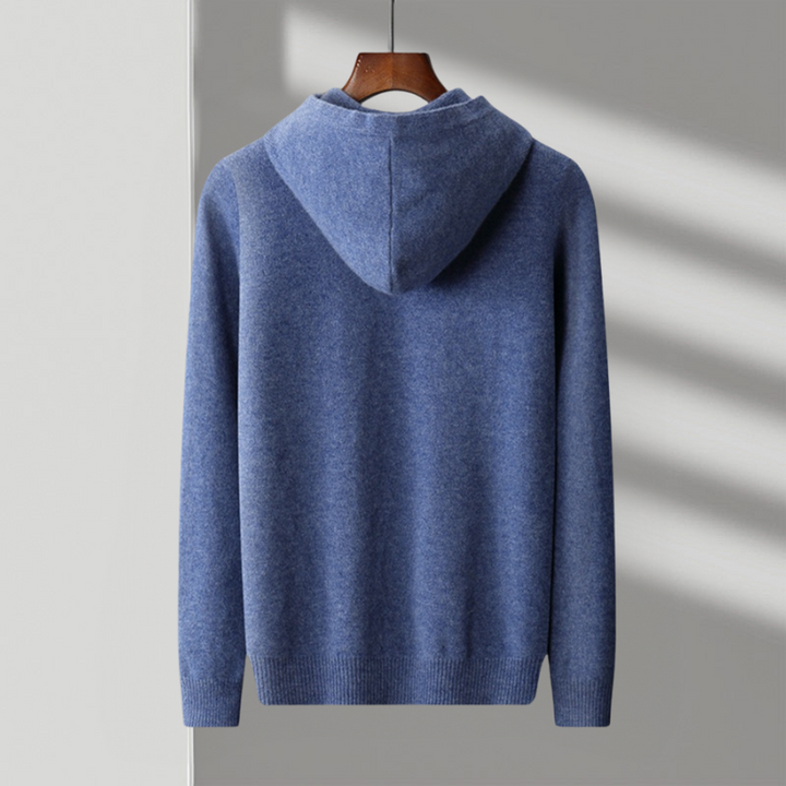Man wearing a classic merino wool hoodie, standing casually. Showcases the fit & comfort for everyday wear.