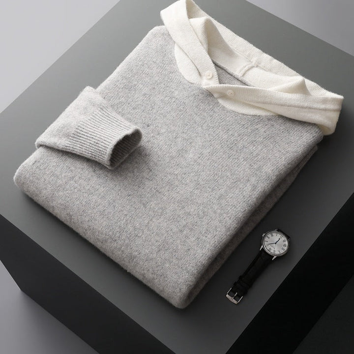 Side view of a man in a merino wool hooded sweatshirt, demonstrating the pullover style and hood profile.
