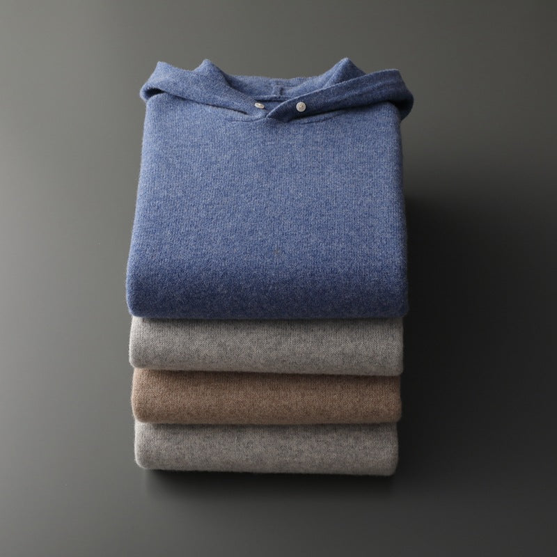 Man stretching in a merino wool hoodie, showing its flexibility and suitability for active casual wear.