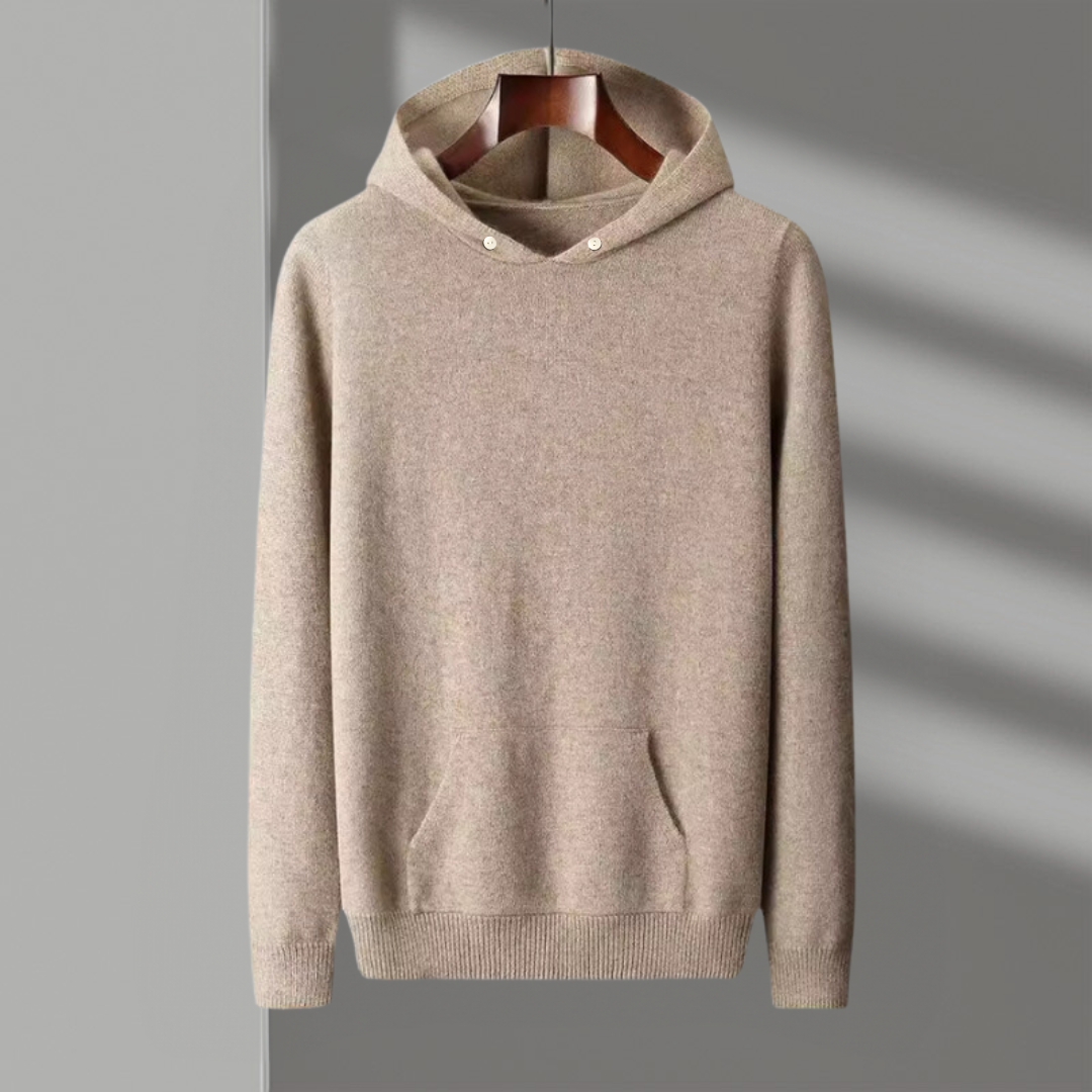 Classic men's merino wool hoodie folded neatly, emphasizing its compact nature & high-quality material.