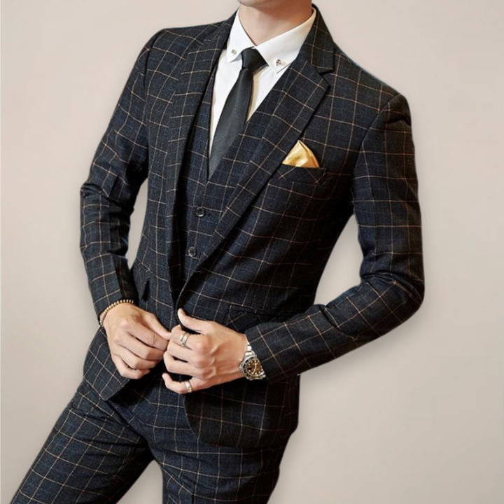 Elegant men's three-piece plaid suit for spring, a sharp choice for formal events and business attire.