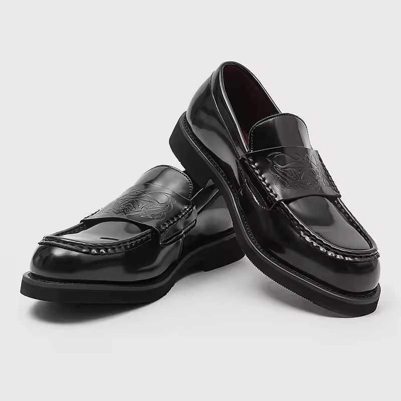 Men's classic polished black loafers, perfect for formal wear or business casual. Elegant slip-on dress shoes.