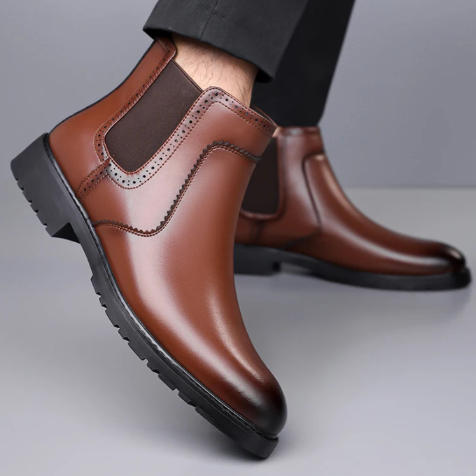 Side profile of Men's polished black leather Chelsea boots, highlighting the elastic gusset detail