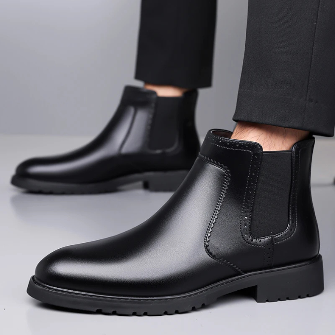 Detailed shot of the stitching and craftsmanship on Men's black polished leather Chelsea boots