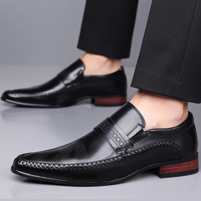 Detailed shot of the lacing and polished texture of men's classic leather dress shoes.