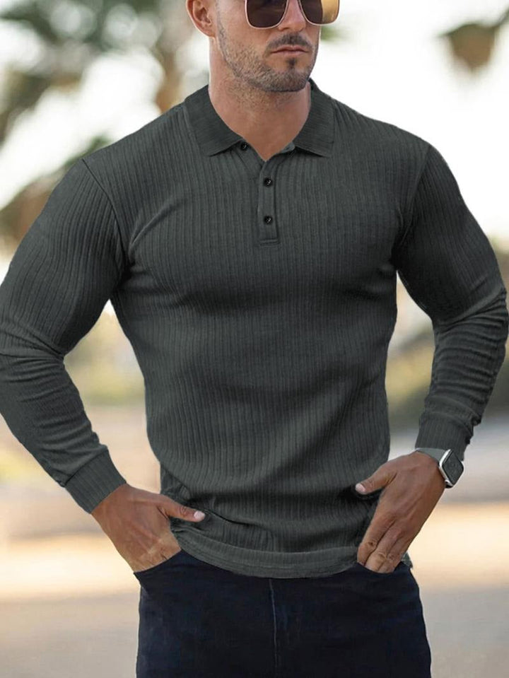 Close-up of the ribbed fabric on a men's long-sleeve polo shirt, highlighting the texture and quality.