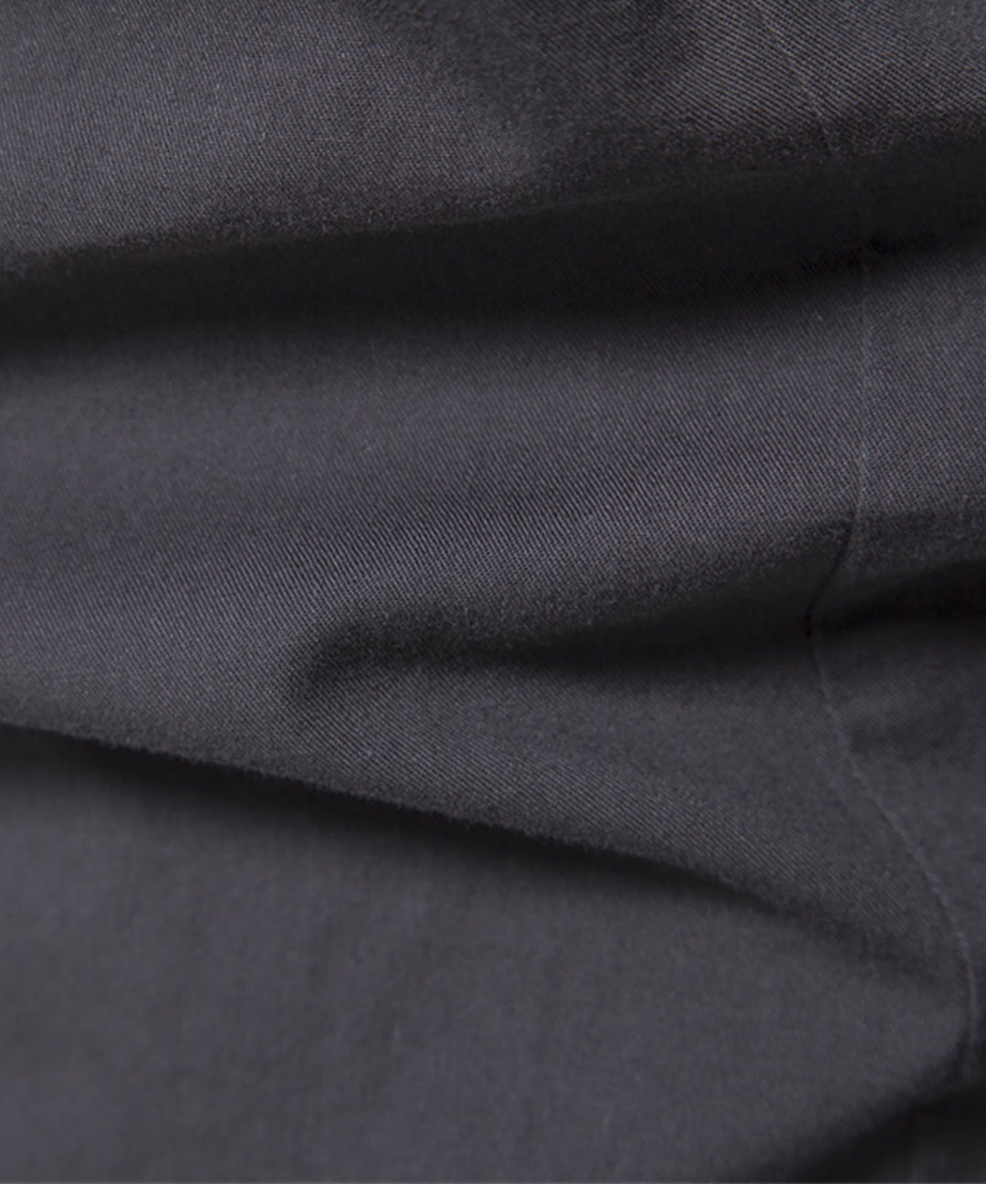 Close-up of the stitching and finishing on a men's premium cotton blend casual shirt.