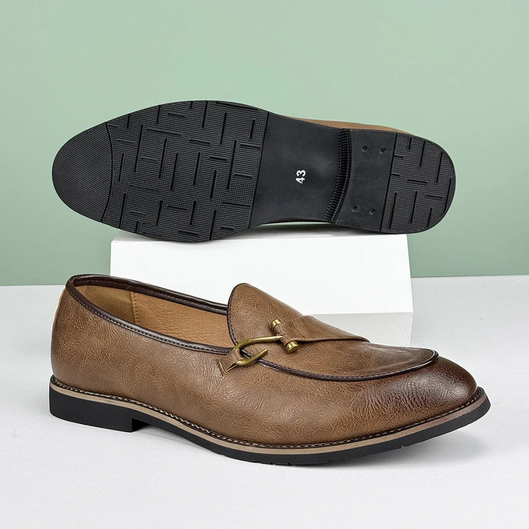 Elegant men's brown leather slip-on bit loafers, timeless and comfortable design.
