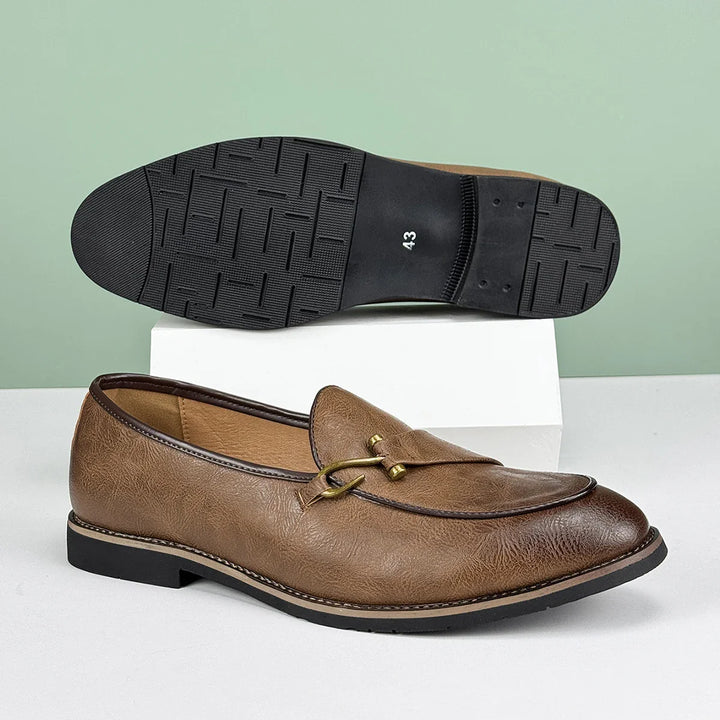 Elegant men's brown leather slip-on bit loafers, timeless and comfortable design.