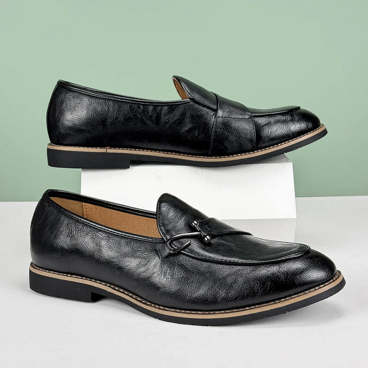 Comfortable men's brown leather slip-on loafers with a distinctive bit detail.