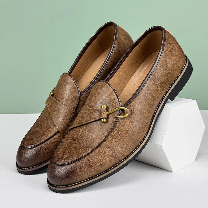 Stylish men's bit loafers in rich brown leather, ideal for a smart casual look.