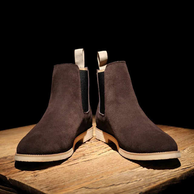 Modern men's Chelsea boots with elastic side panels. Durable slip-on ankle boots for everyday comfort and style.