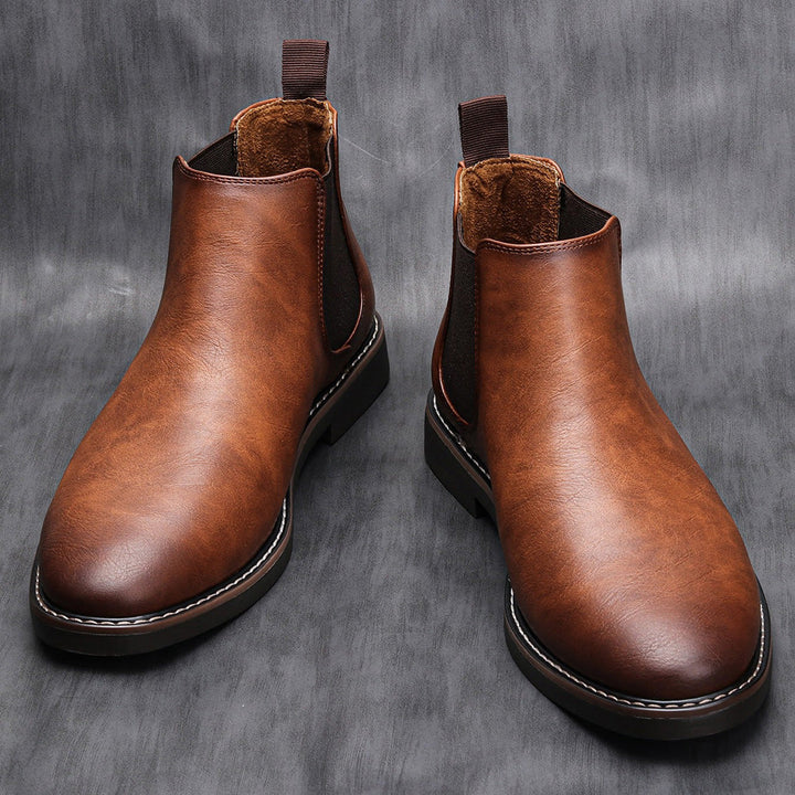 Men's Classic Slip-On Chelsea Boots in dark brown leather, side view, for casual or dress wear